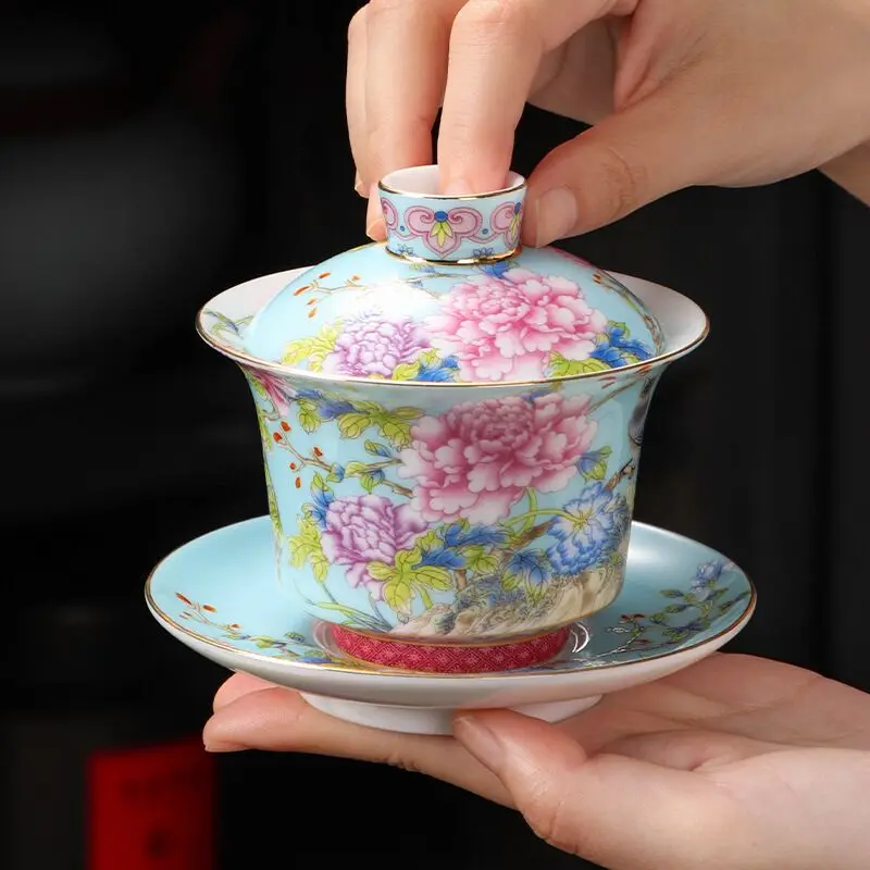 

Enamel peony lid bowl, a simple and elegant three-part tea set in traditional Chinese style, used for brewing and serving tea.