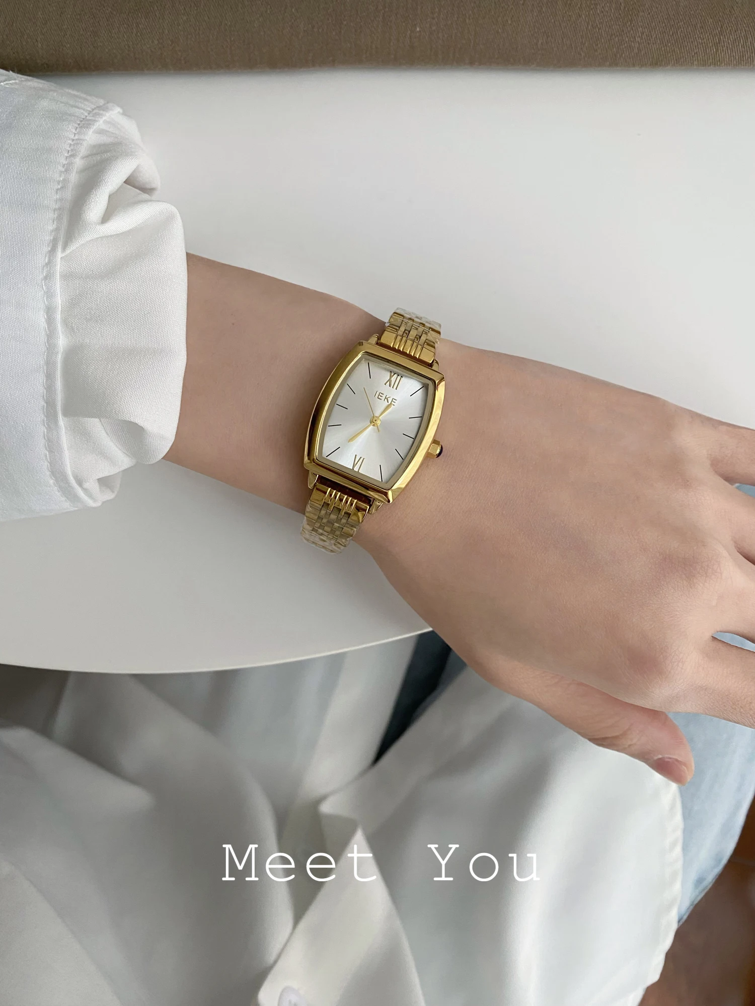 Asophisticatedminimalist Koreanstyle women's watch with a barrelzhapeddesign and a steel strapA unique timepiece gift for ladies