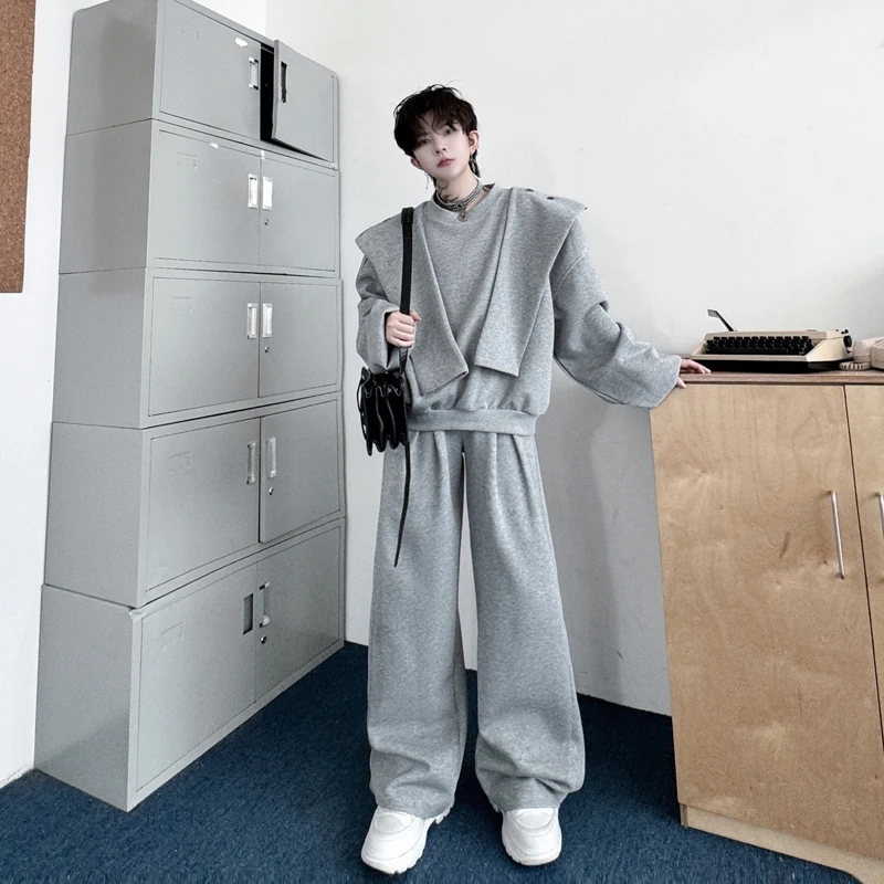 

Комплект из двух предметов: повседневный спортивный костюм премиум-класса с отстегивающимся капюшоном и брюками свободного кроя для подростков. Осенняя мода.