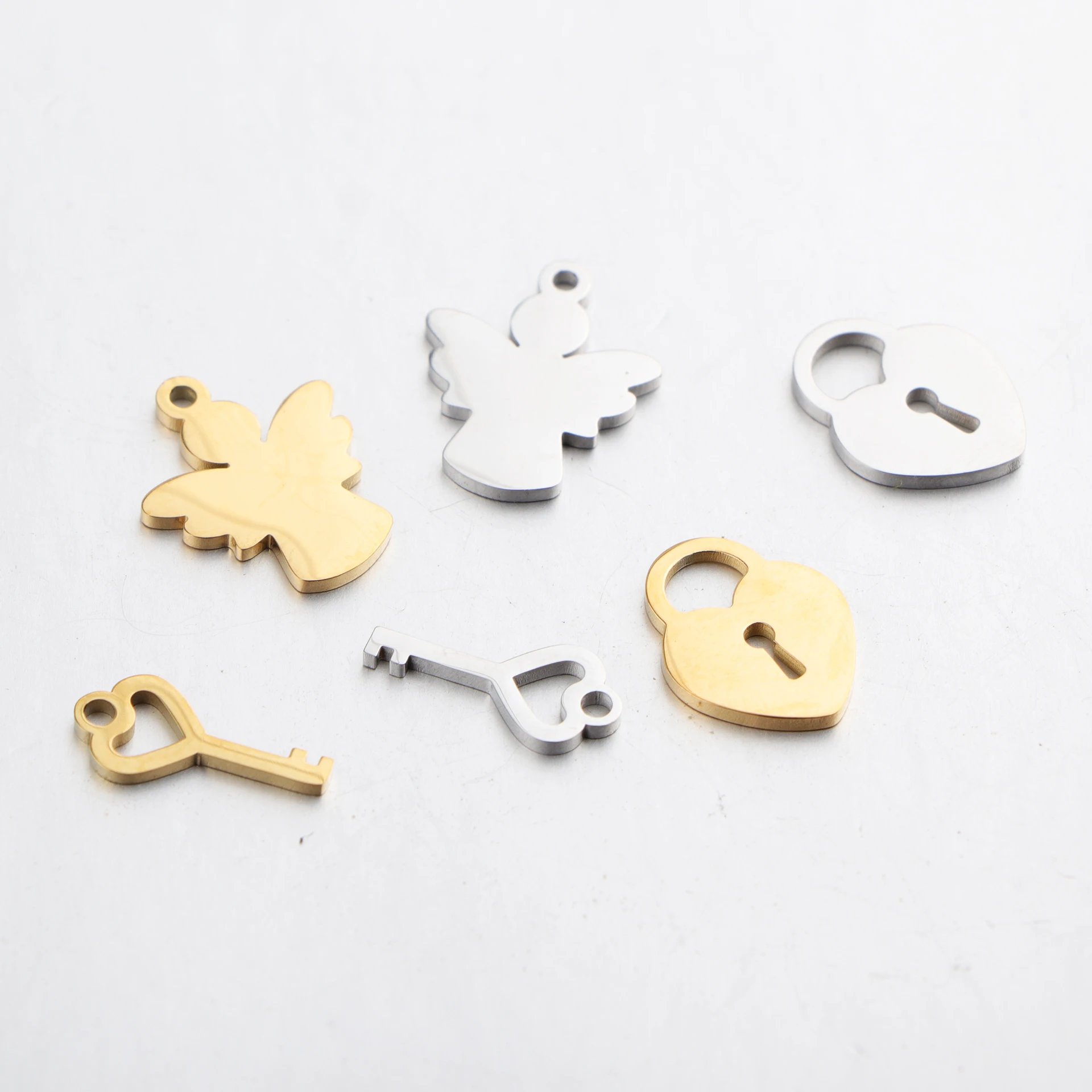 

20pcs/lot Mirror Polished Stainless Steel Mini Lock and Key Angel Charm Pendant for DIY Necklace Bracelet Earring Jewelry Making