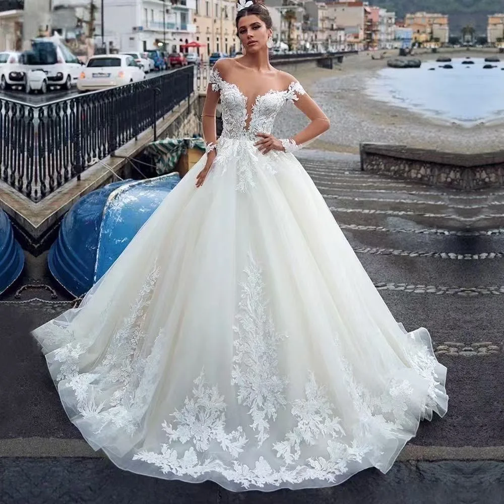 تخصيص فساتين زفاف فاخرة مزينة بالدانتيل مثير الوهم كم طويل زر ذيل شابيل ألين فستان زفاف Vestidos De Novia