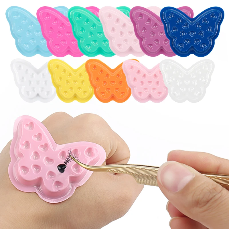 100 Stück Einweg-Schmetterlings-Wimpernkleberhalter PVC-Klebertrays Wimpernverlängerung Tattoo-Pigment-Mischpalette Make-up-Werkzeuge