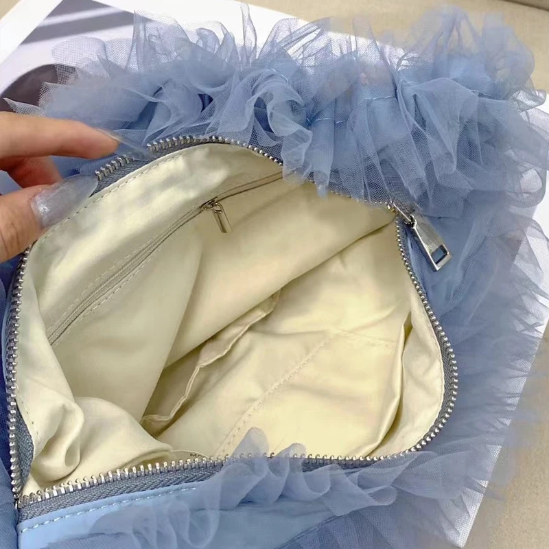 Bolsos coreanos informales de media luna para mujer bolsos y monederos de diseñador de lujo novedad de 2024 en decoración de volantes de poliéster bolso de hombro pequeño de tela para las axilas alta calidad