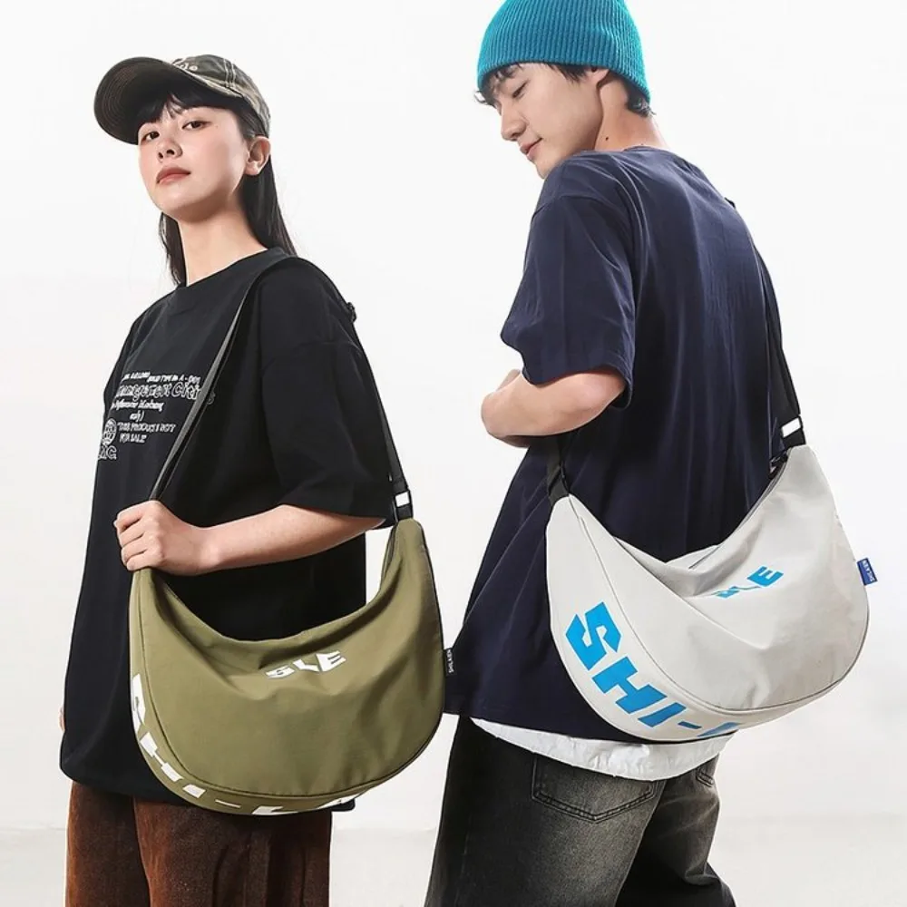 

Large Capacity Nylon Shoulder Bag Multi-Functional Streetwear Japanese Style Dumpling Bag Commuting Solid Color Crossbody Bag
