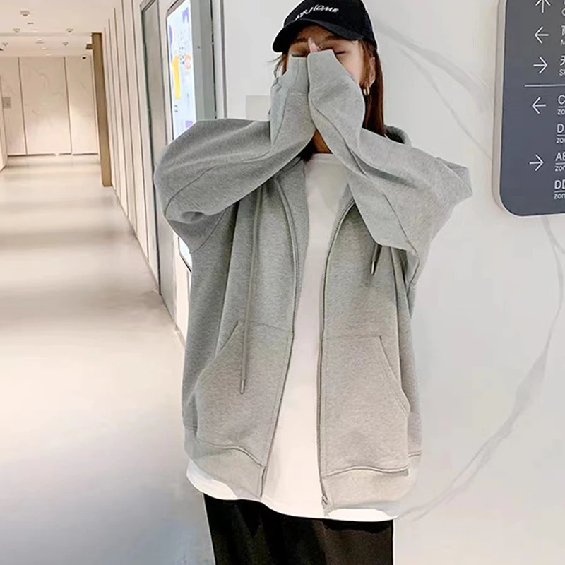 حجم كبير فضفاض سستة هوديس أسود بلون مقنعين بلوزات الموضة الكورية كم طويل جيوب الرباط CYXX086