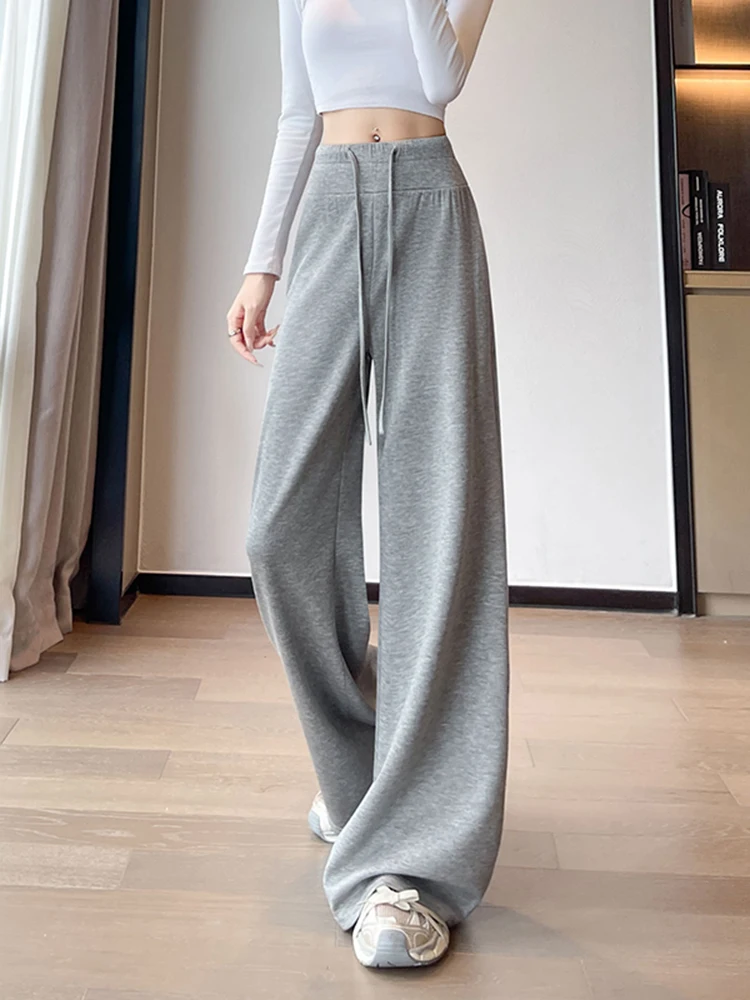 Koreańskie spodnie sportowe typu stringi z wysokim stanem, damskie, jesienne, nowe, jednokolorowe, zwiewne, z szerokimi nogawkami, uniwersalne, wyszczuplające.
