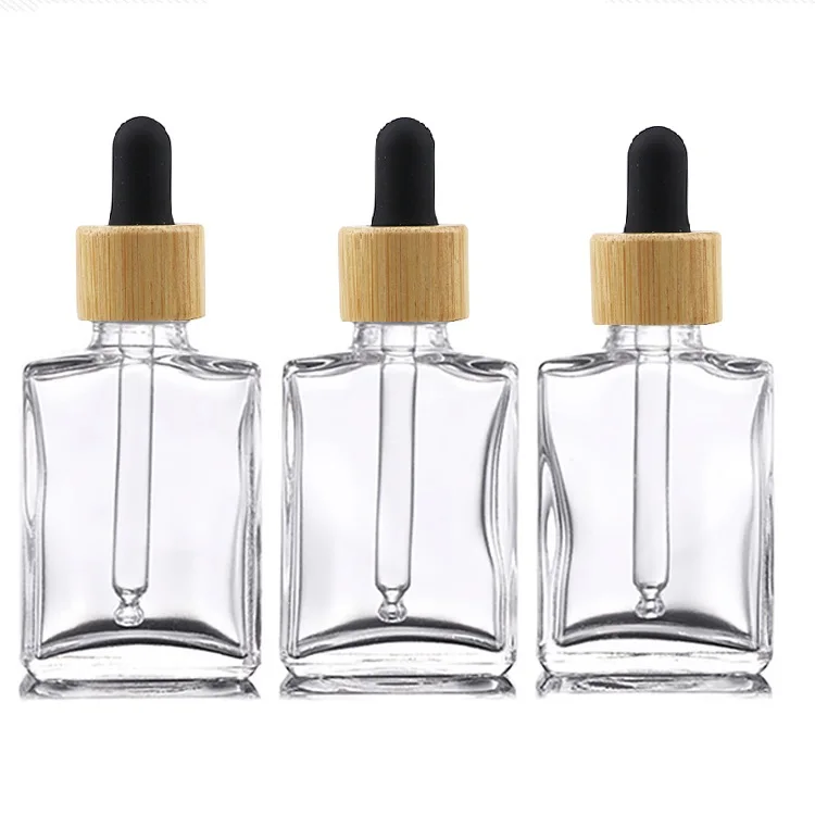 Botella de suero de aceite con cuentagotas de vidrio cosmético, frasco vacío Popular, transparente, plano, cuadrado, rectangular, 1oz, 30 ml, 30 ml, con tapa de bambú, 15ml, 100ml