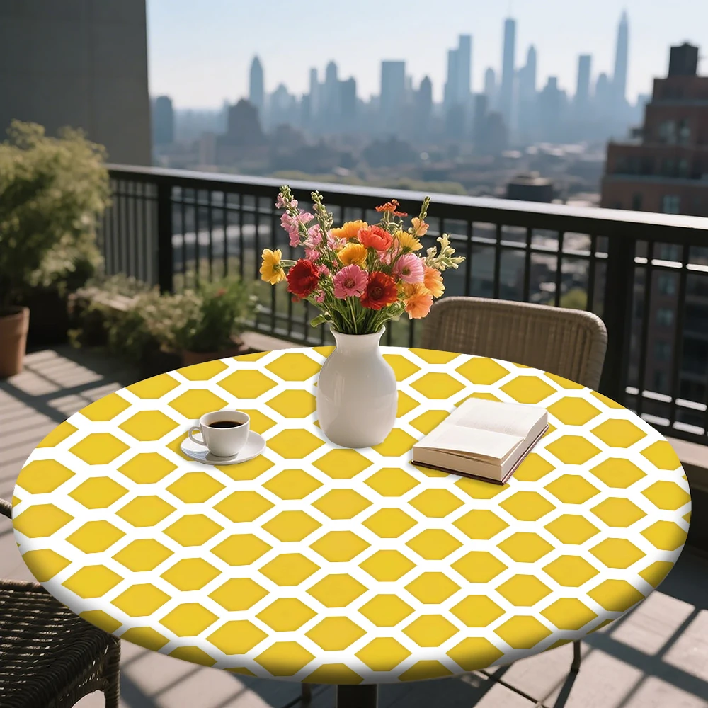 The round elastic tablecloth features a yellow and white hexagonal pattern. Made of polyester, it's suitable for indoor dining r