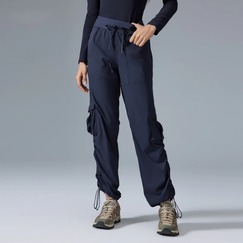 Women's 2025 Activewear Cargo Pants side profile demonstrating tapered ankle cut and articulated knee construction