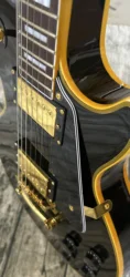 Customized electric guitar, black caston, yellow logo and body binding, gold accessories, lightning package