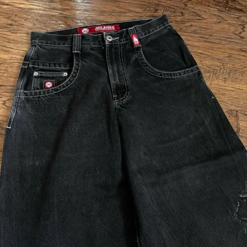 ملابس شارع هاراجوكو داكنة بانك تصميم شوكة بيضاء سراويل مستقيمة فضفاضة على الموضة الأمريكية جينز كبير الحجم للجنسين