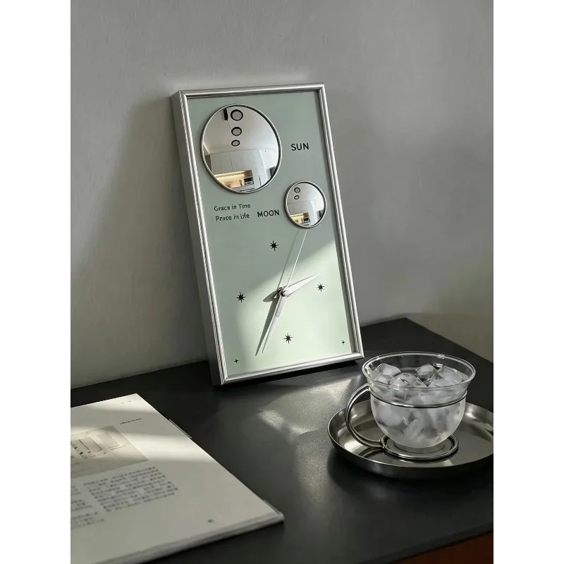 Bauhaus sun and moon silent pendulum clock, modern simple living room home clock niche light luxury bedside table ornament