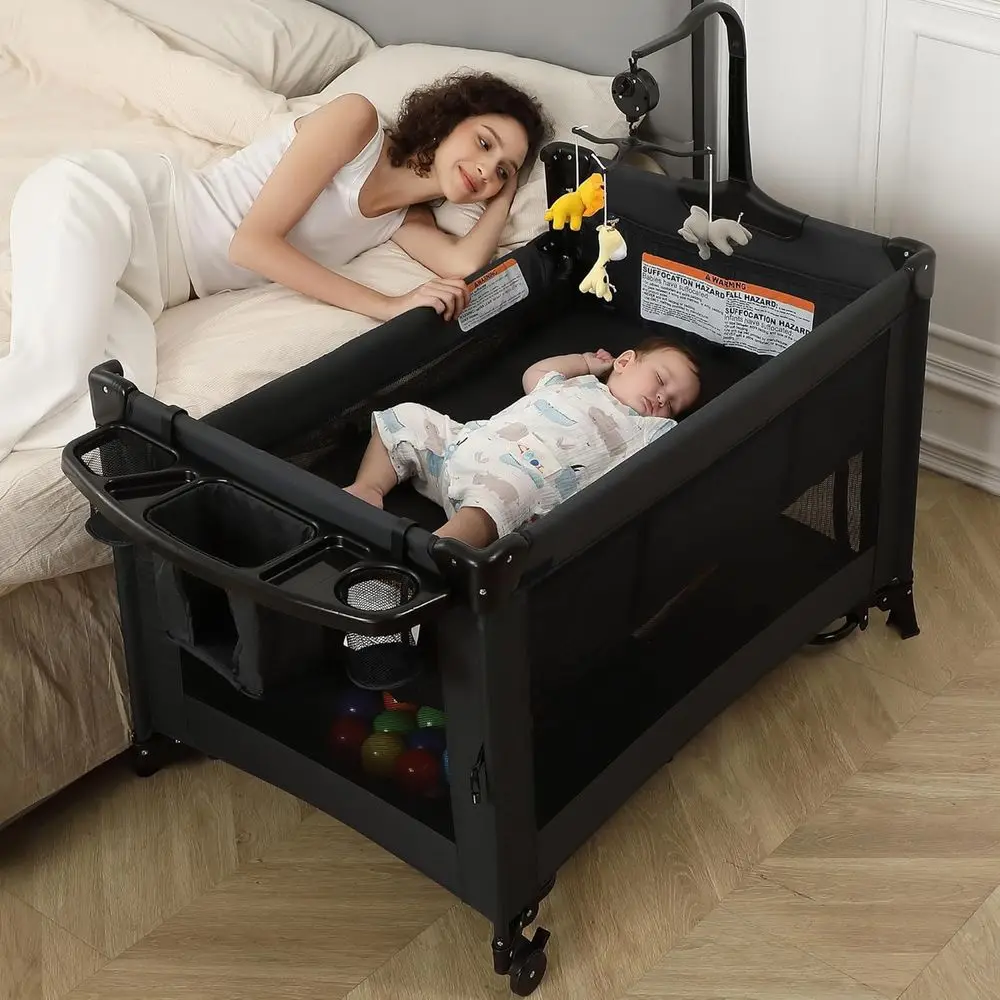 All-in-One Portable Playard, Bedside Bassinet Sleeper, Changing Table Playpen for Newborns to Toddlers (Black)