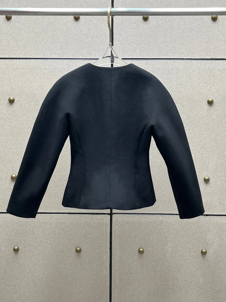 Black tailored blazer with a fitted waist and rounded shoulders—a sophisticated new style for Autumn/Winter 2026.