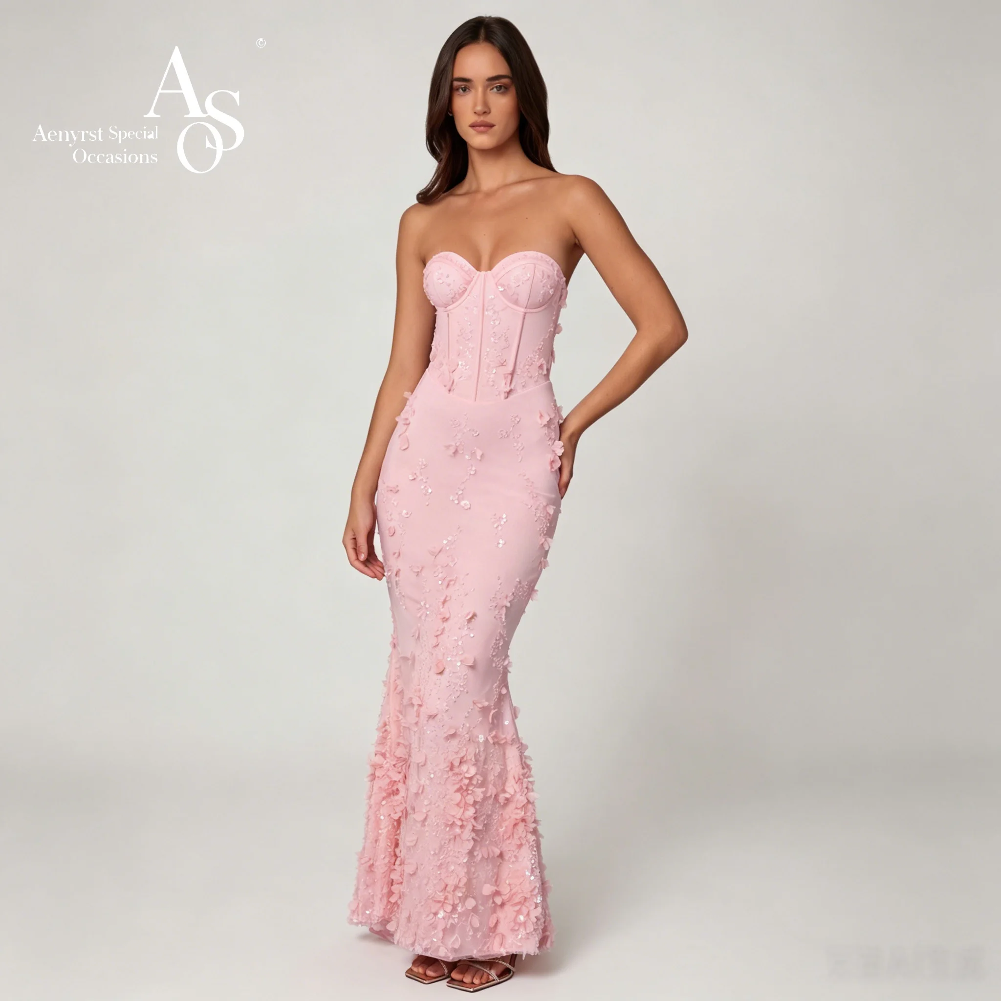 

Glamorous pink strapless sleeveless floor-length mermaid formal gown featuring sequin appliqué