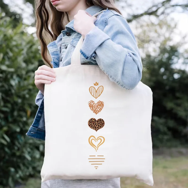 حقيبة نسائية عادية ذات سعة كبيرة حقيبة كتف قماشية موضة Harajuku للمتسوقين الحد الأدنى المائية القلب طباعة حقائب الشارع