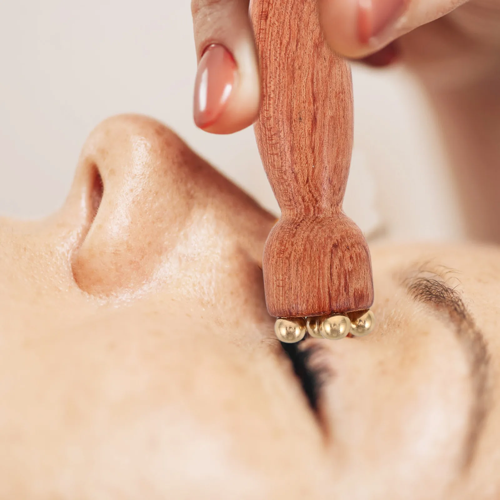 Wooden Eye Roller Massager Wood Copper Beads Under Eye Massage Tool Mini Lotus Pod Shape Facial Roller Spa Face view 2
