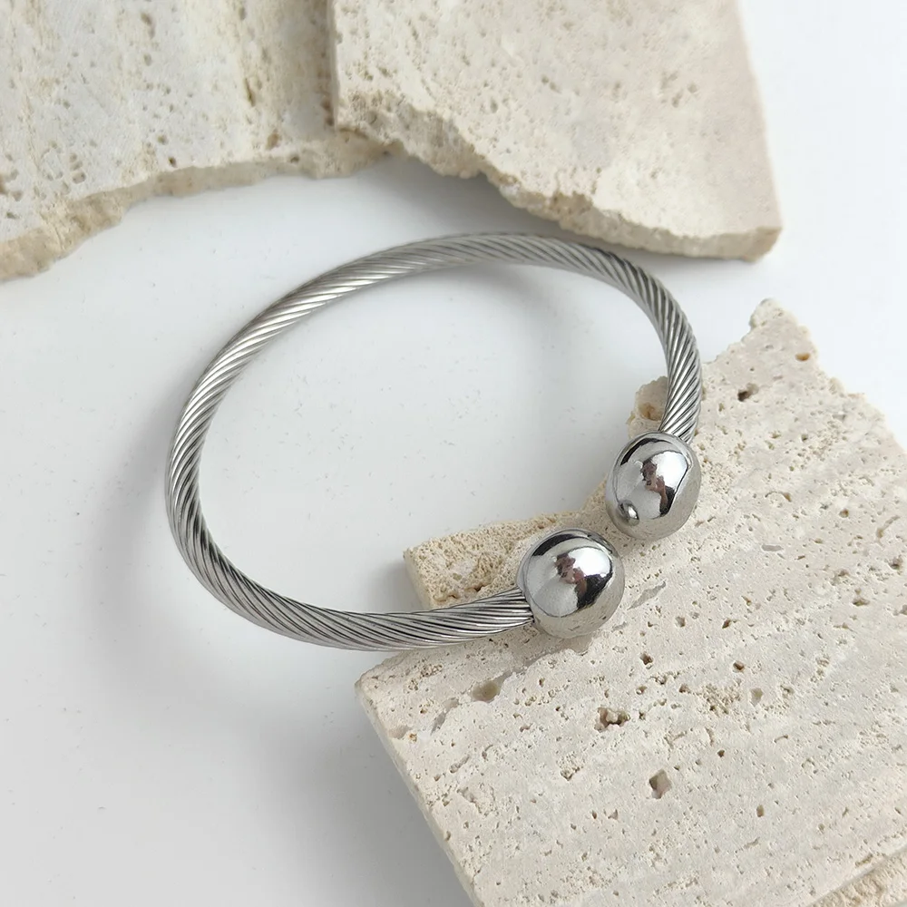Double ball gold-plated stainless steel bracelet, twisted steel wire C-shaped design, classic fashion jewelry