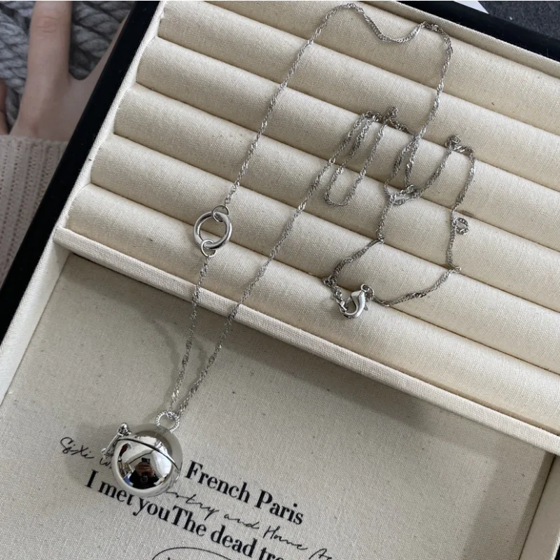 

Korean blogger's same hollow spherical pendant can open sweater chain