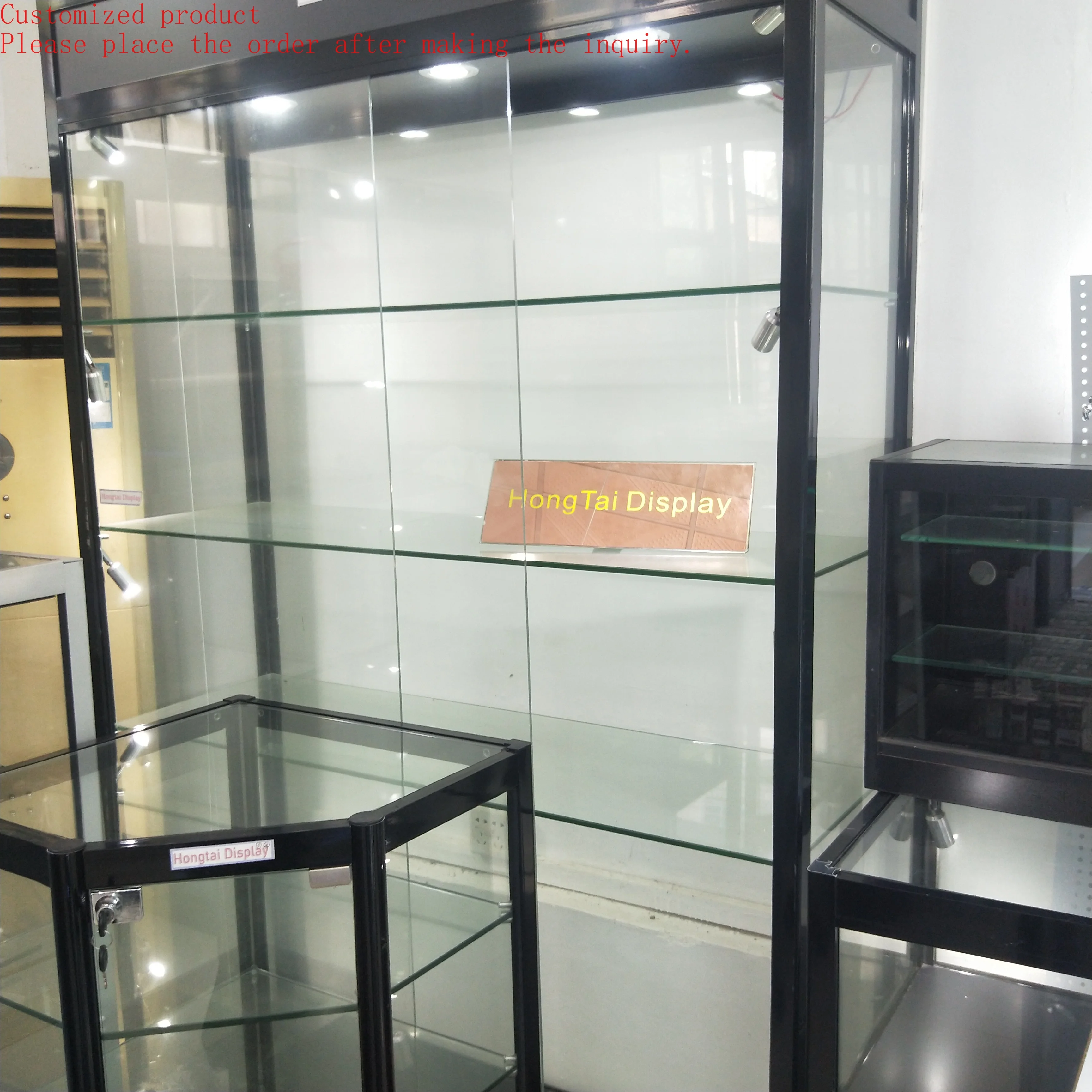 

Custom.Hot Selling High End Tempered Glass Wall Display Cabinet With Led Lighting Shopping Mall Display Tall Cabinet