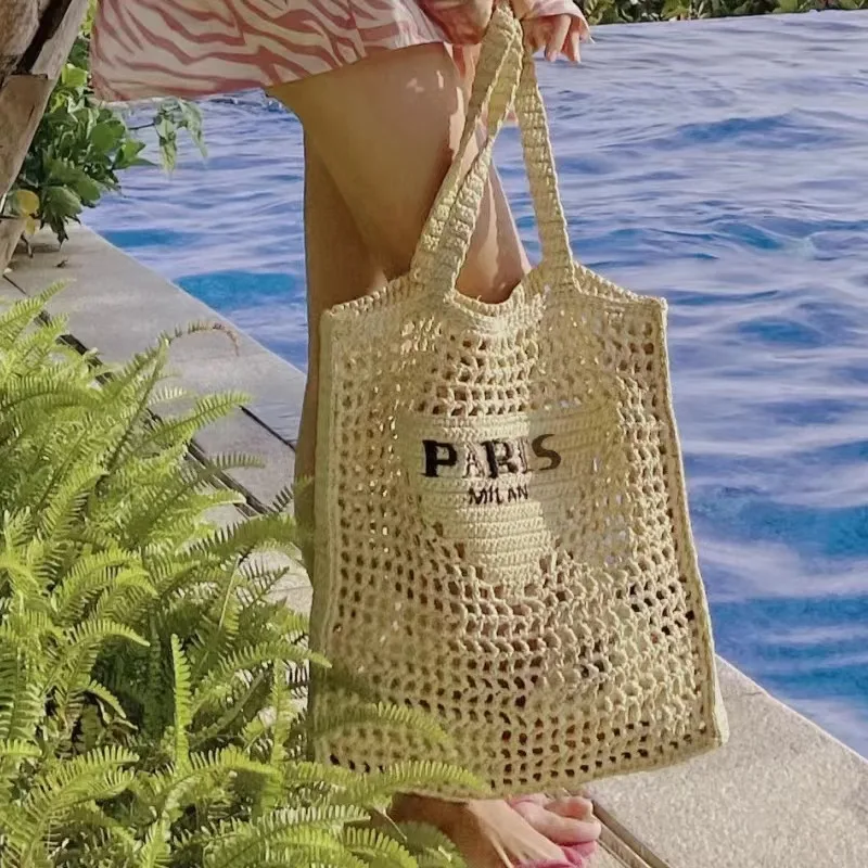 New spring and summer hollowed-out one-shoulder tote bag embroidered letter paper rope straw woven bag women\'s portable beach ba