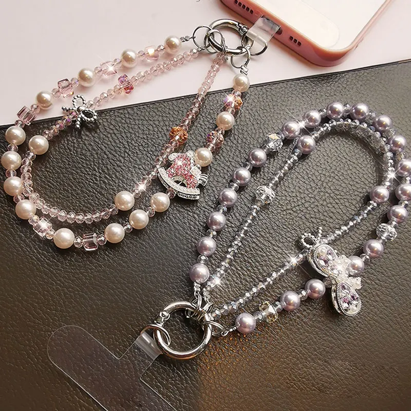 Bracciale da polso con cordino per telefono in cristallo scintillante con catena per telefono con fiocco di lusso e perla per accessori per custodie per telefoni