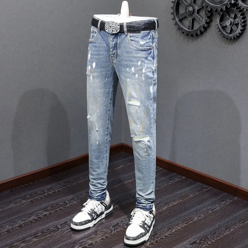 

Fashionable new men's jeans with painted perforations, patch buttons, light blue placket, high street trendy hip-hop brand, high