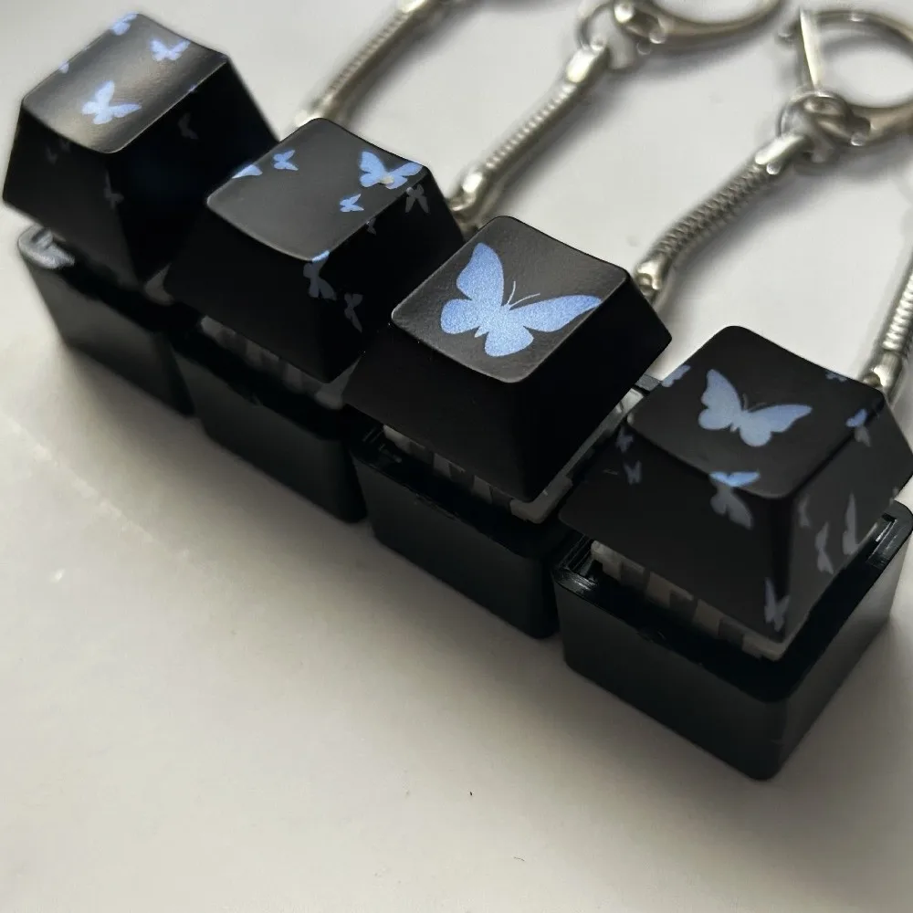 Decompressione 4 tasti Pulsante Keycap Portachiavi Tappi tastiera Pulsante brillante Keycap Passa il tempo Sollievo dallo stress Clicker Giocattolo Regalo