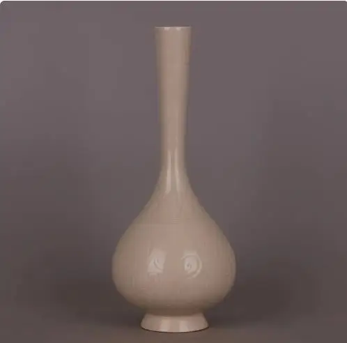 

Antique ornament: Porcelain vase with carved flower patterns from Dingyao Kiln in the Song Dynasty