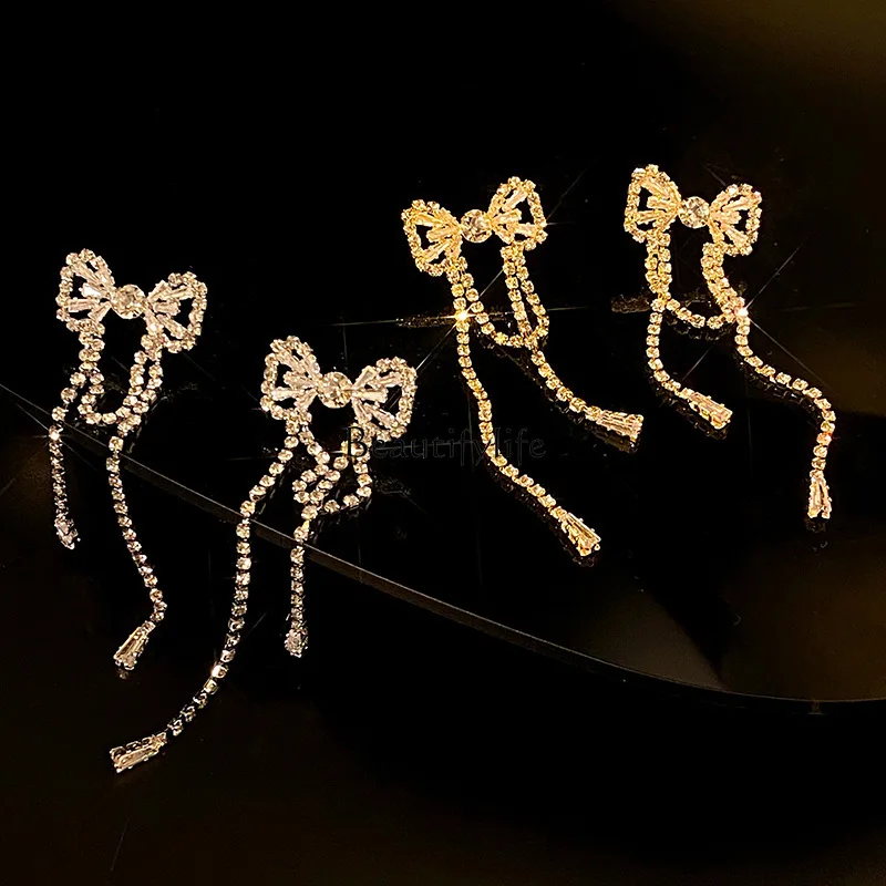 

Noble bow earphone dinner with fashionable earrings and high-end tassels