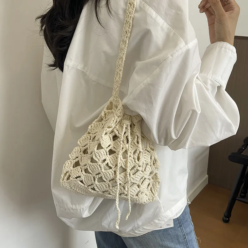 Solid Color Hollow Out Handmade Crochet Drawstring Small Bag For Women Artistic Style Woven Mini Change Phone Bag 2026 New