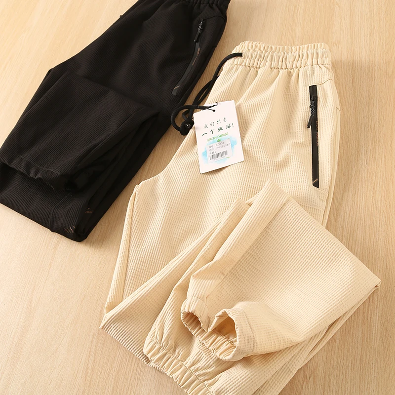 

Faionable Urban Youth Casual Pants Men's Spring Summer Elastic Waist Bubble Cloth Comfortable Loose Fit Sports Leisure Trou...