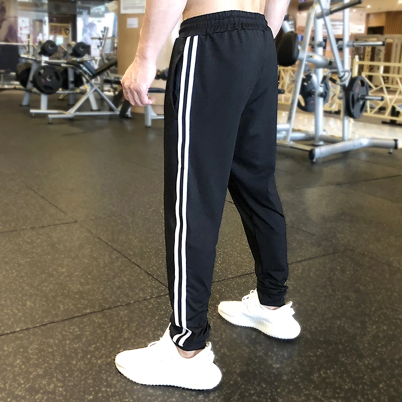 

Men's Casual Skiny Pants Training Gyms Sportswear Male Trousers Joggers Sport Pants with stripes Training fashion Sweatpants