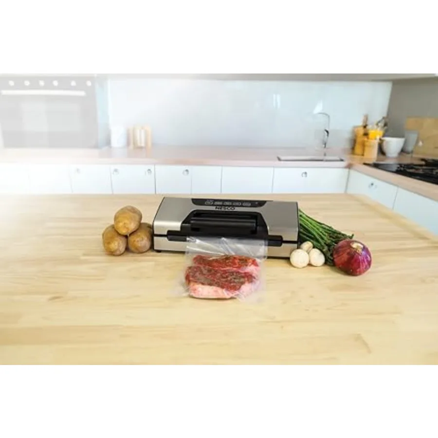 

Vacuum sealer for kitchen use stainless steel body silver color moist/dry sealing and roll storage functionality