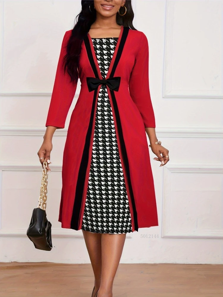 Fake two-piece splicing dress V-neck longitudinal contrast color design bow waist three-quarter sleeves A pendulum to slimming