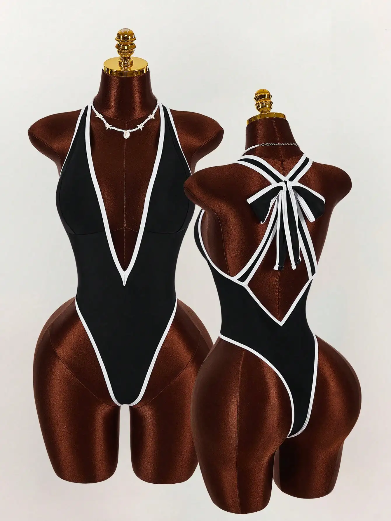 

Женский однотонный купальник с глубоким V-образным вырезом и бантом на спине