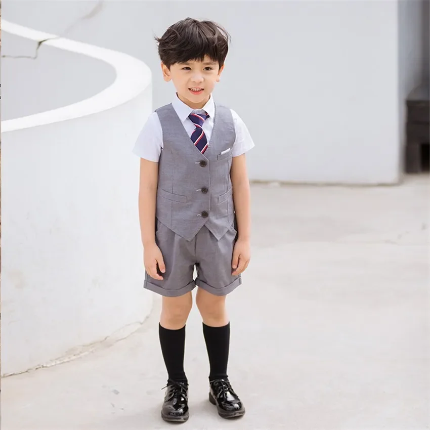 Uniforme scolastica coreana per bambini Ragazzi Ragazze Gonna a pieghe Canottiera Top Set di abbigliamento per prestazioni per bambini Abbigliamento da palcoscenico Uniforme da studente
