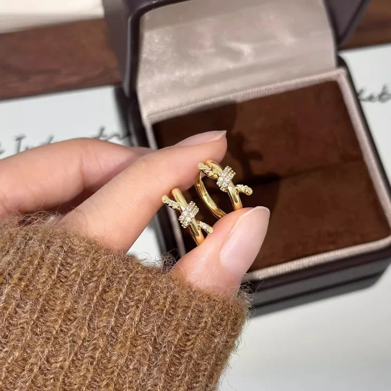 

Women's Micro-Inlaid Zircon Gold Knot Huggie Hoops - 2026 New Luxury Versatile Temperament Earrings