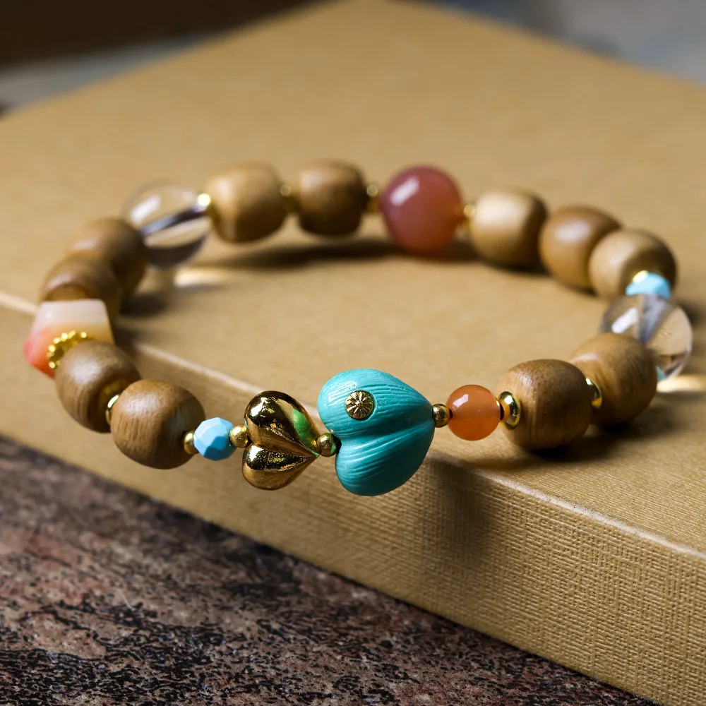 

2025 Autumn New Yellow Qinan Agarwood Chinese Style Cultural Play Bracelet with Magnesite Pine Stone and Peach Blossoms Bracelet