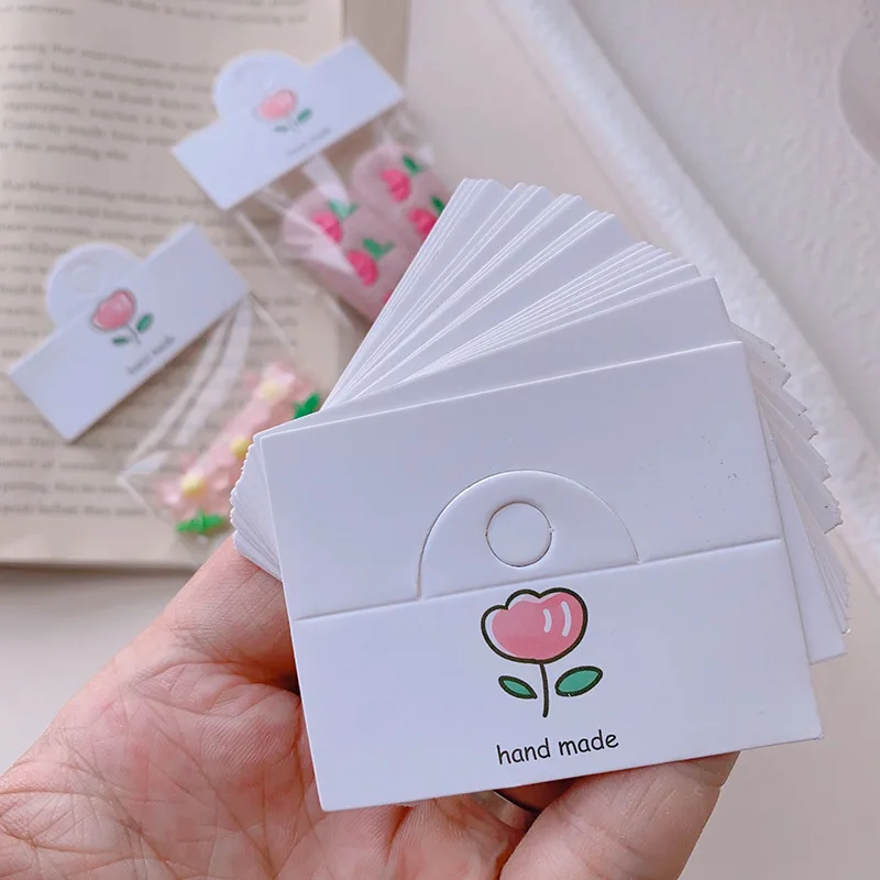 50 stücke Kirsche/Bogen Knoten/Blumenmuster hängende Karte 6,4x4cm faltbare Tag für Haarschmuck Verpackung Schmuck Einzelhandel Preis schild