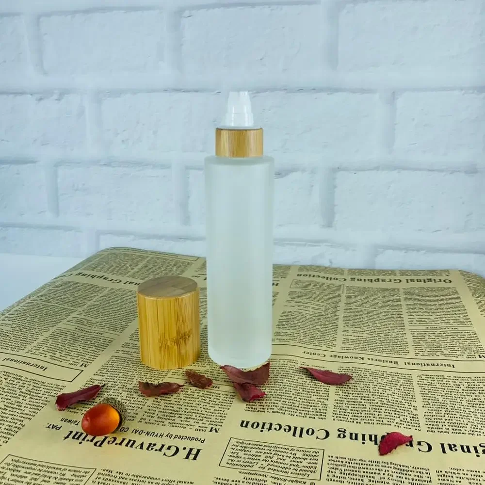 

popular selling Glass Bottles Empty Glass Jar with Bamboo Wood Pump Lid Frosted Glass Bottle sample containers bottle with caps