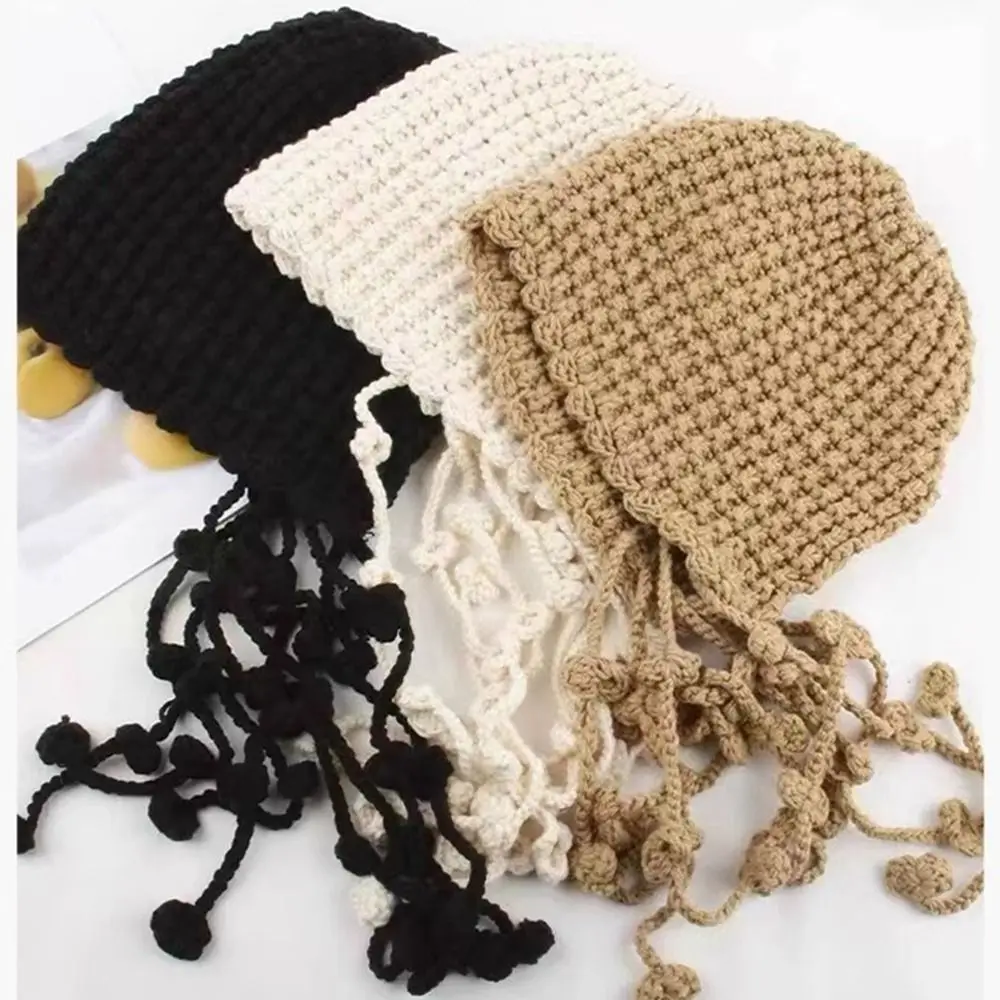 かわいいタッセルかぎ針編みニット帽子中空アウトボヘミアンスタイルニットキャップ手作り韓国織りキャップアパレルアクセサリー