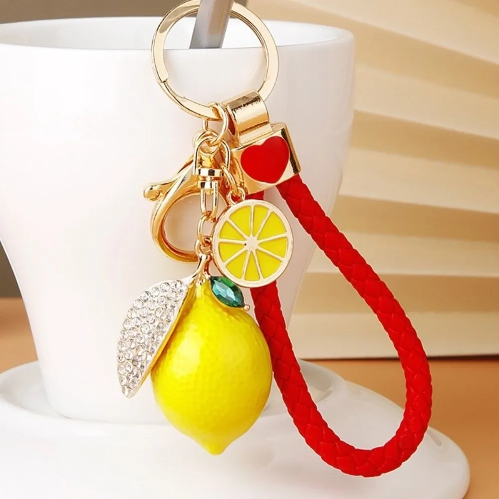 Süßer Zitronen-Schlüsselanhänger aus Legierung, kreativer Fruchtform-Anhänger mit geflochtenem Seil, Taschenanhänger, 3D-Metall-Schlüsselring, Geschenk – Detail 2