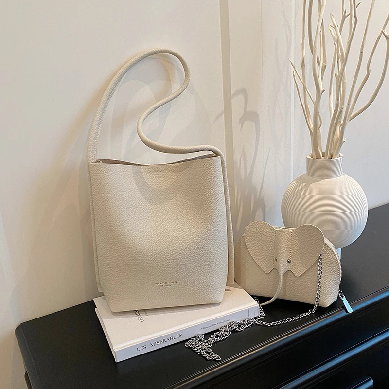 

Retro large capacity commuting mother and child bag 2025 new fashionable and versatile travel one-shoulder bucket bag