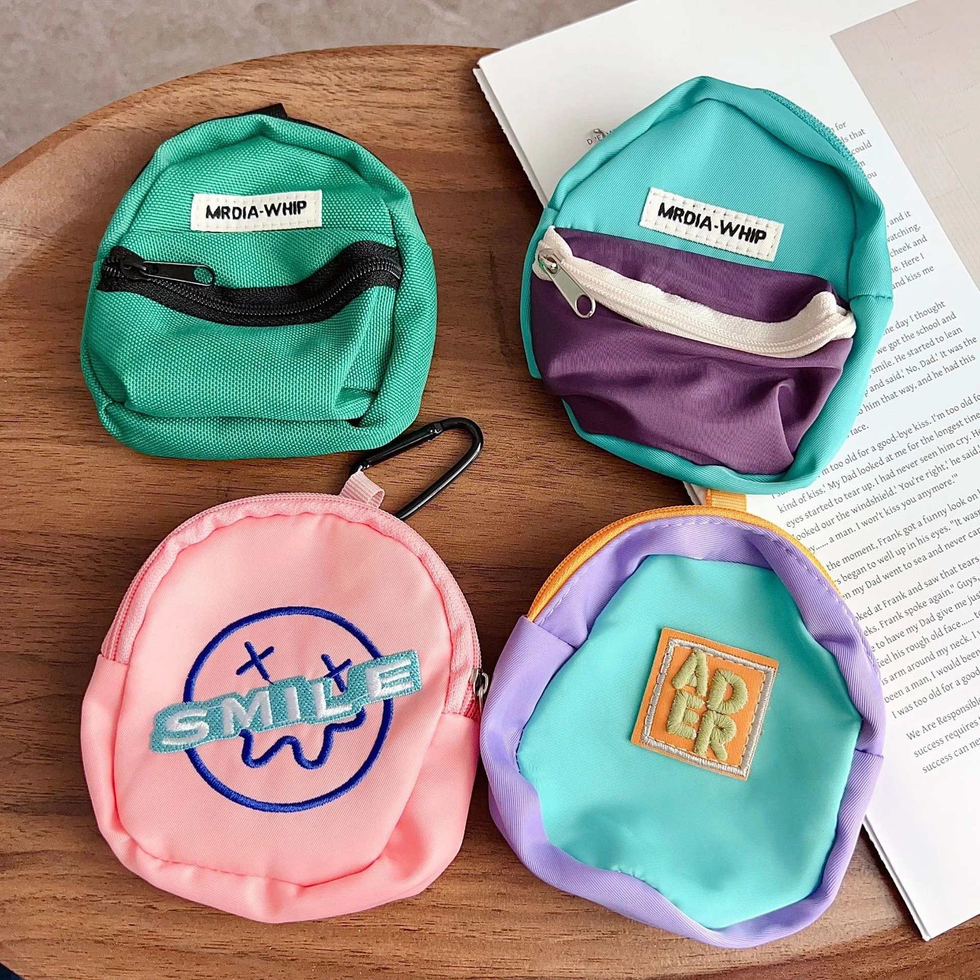 Creative new trendy small schoolbag for convenient storage, key and earphone universal anti-loss pendant