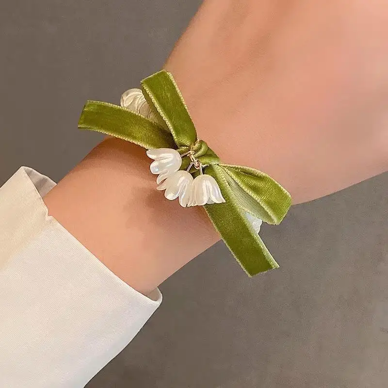 

2025 New Arrival Lily of the Valley Bow Skinny Scrunchies – Fairy-Tale Fresh High-End Hair Ties for Women