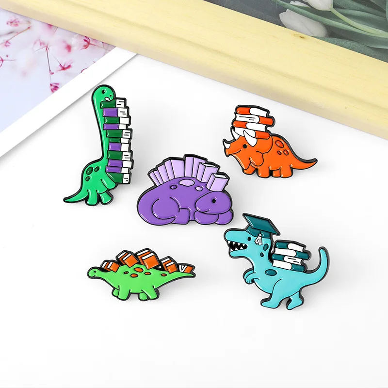 Dinosaur and Books Enamel Pin Custom Reading Habit Animal Brooch Bag Clothes Lapel Pin Badge Cartoon Jewelry for Kid Friend