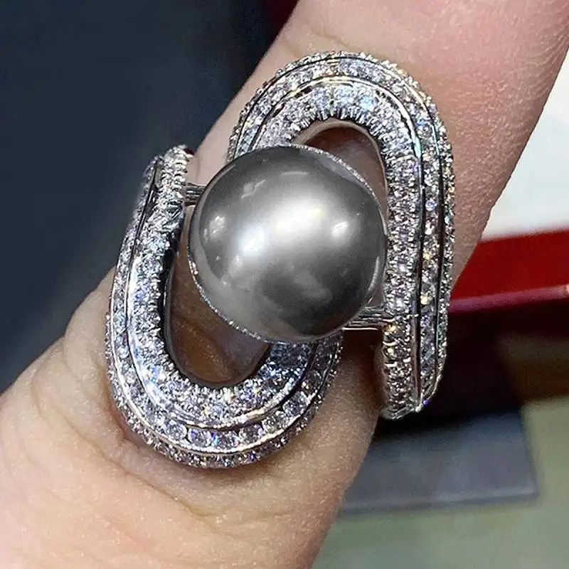 Huitan Luxus-Ringe für Damen, schwarz, künstliche Perle, Finger-Accessoires, Party, Urlaub, einzigartiges Design, eingelegter glänzender CZ-Modeschmuck
