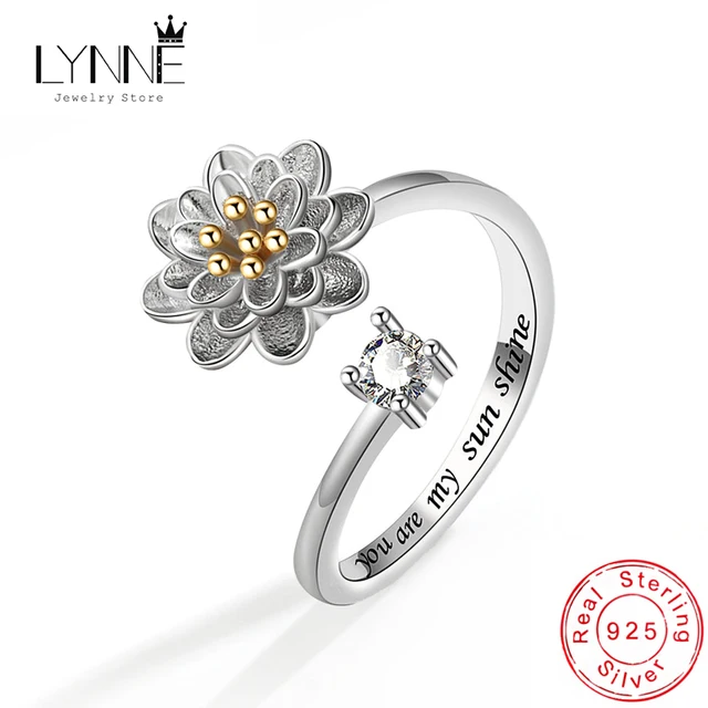 Anillo de plata giratorio con margaritas en oro rosa