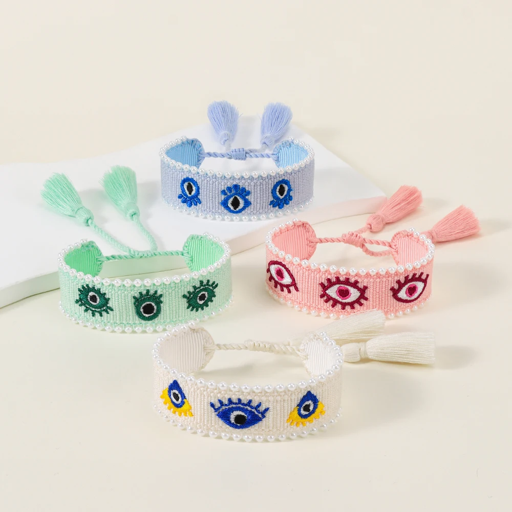 

Handmade Woven Evil Eye Bracelet with Pearls & Tassels – Stylish Protection Jewelry & Meaningful Gift